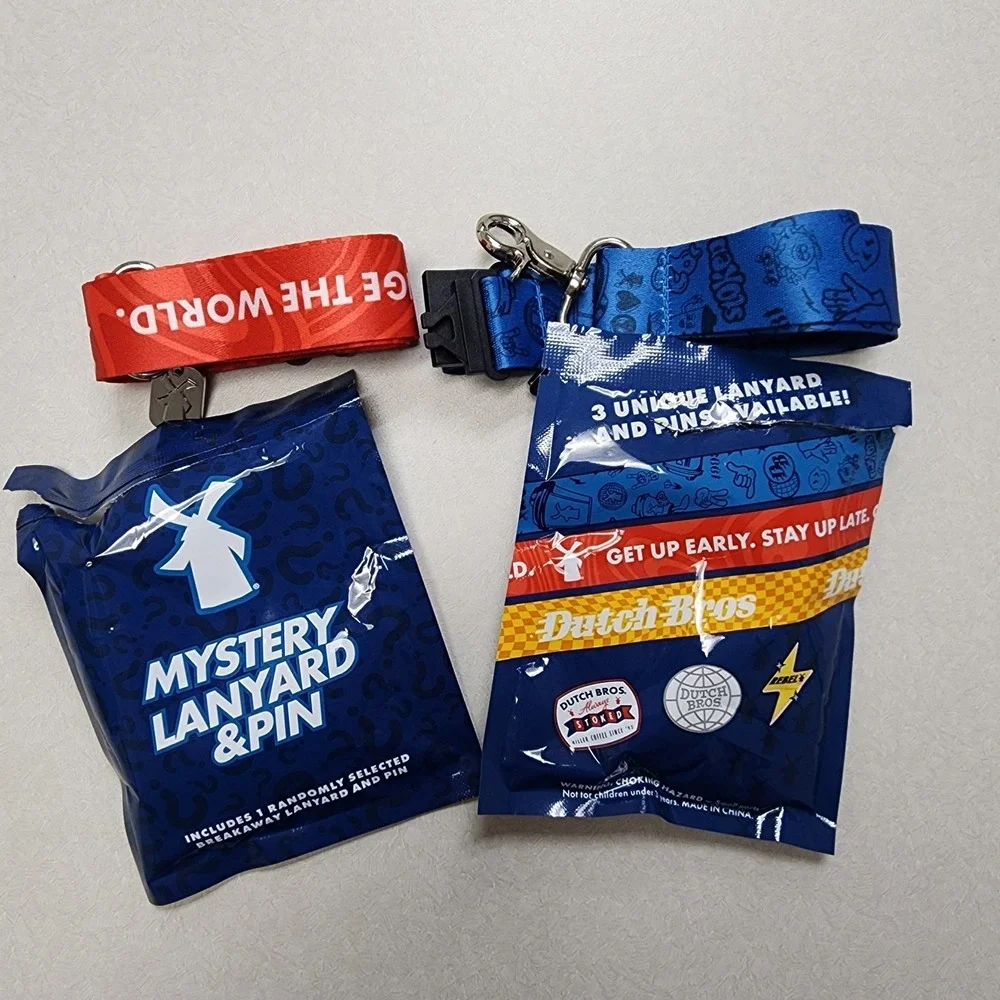 Set Of 2 Dutch Bros Pin and Lanyards 6/25/26 Red/Blue Lightning Bolt Always Stok